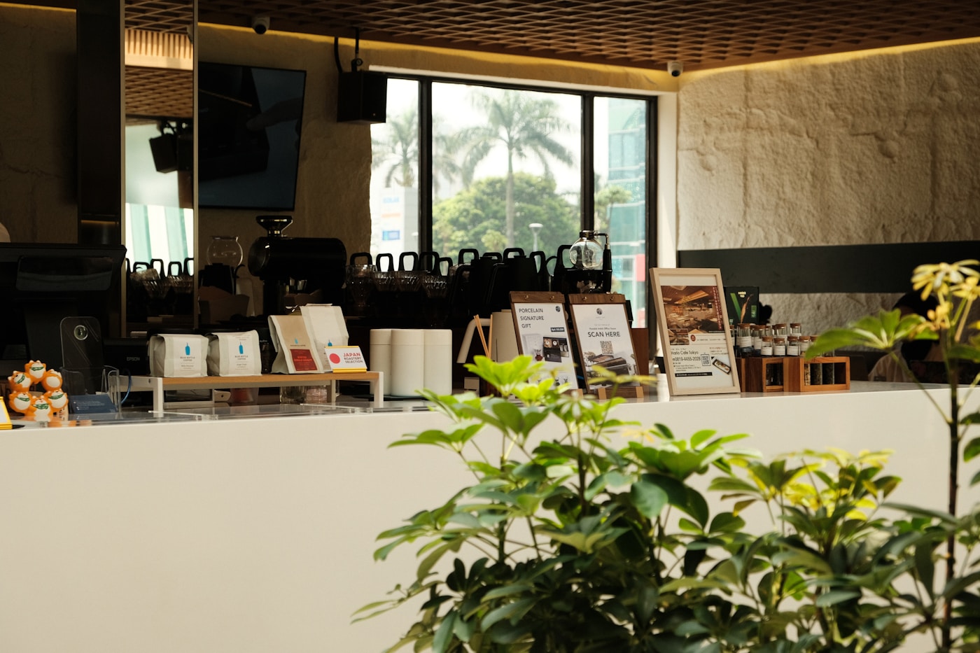 Warm cafe counter with materials and low evening light